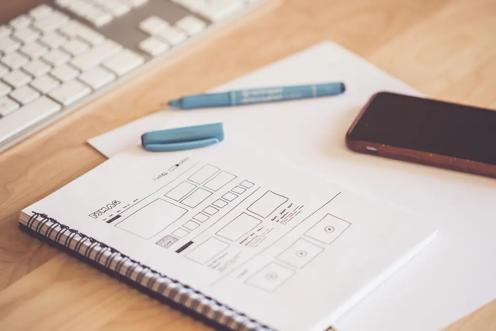 Workspace for planning an MVP or proof of concept with product notes, diagrams, and software tools.